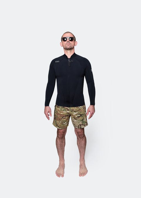 Man wearing a black 00 BY XIIIG 2mm front-zip Do wetsuit jacket and camouflage boardshorts on a white background
