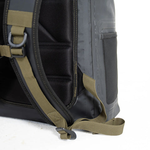 Close-up of a black backpack with green straps on a white background
