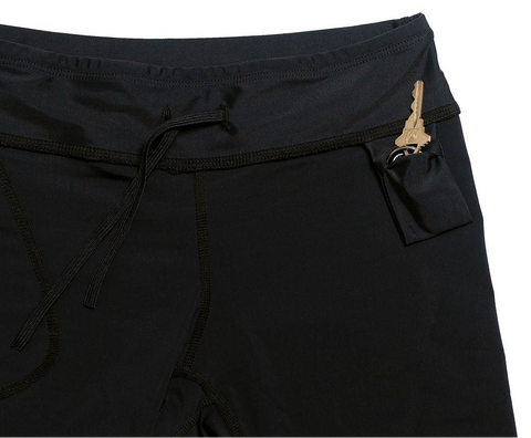 Inside of black jammer compression shorts showing the pillow pocket with a gold ring on a key ring sticking out