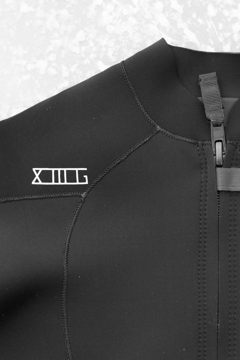 Black 00 BY XIIIG 2mm wetsuit jacket with a visible XIIIG logo on a light gray background