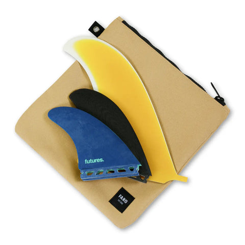 Three surf fins (yellow, blue, black) on a tan carrying case with 'FARO' branding.