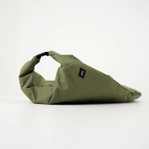 Olive green surfboard bag clasped together with the FARO logo