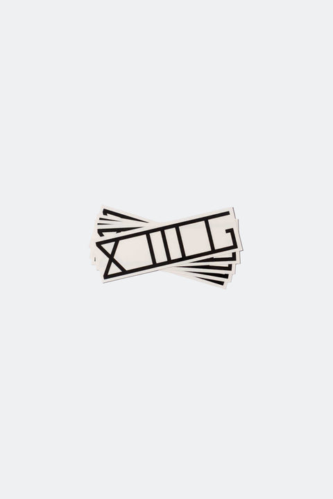 A stack of fanned out XIIIG stickers with black lettering and a clear background